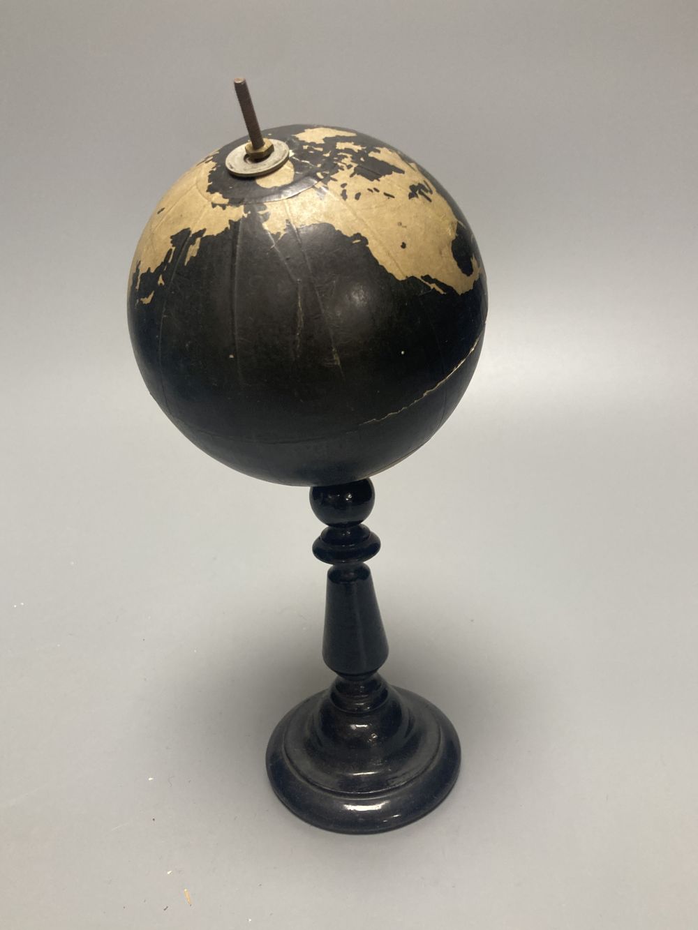 A Reliable Series lithographed tinplate revolving globe, 20cm, and two graphic globes,on ebonised wood bases, one by Philips